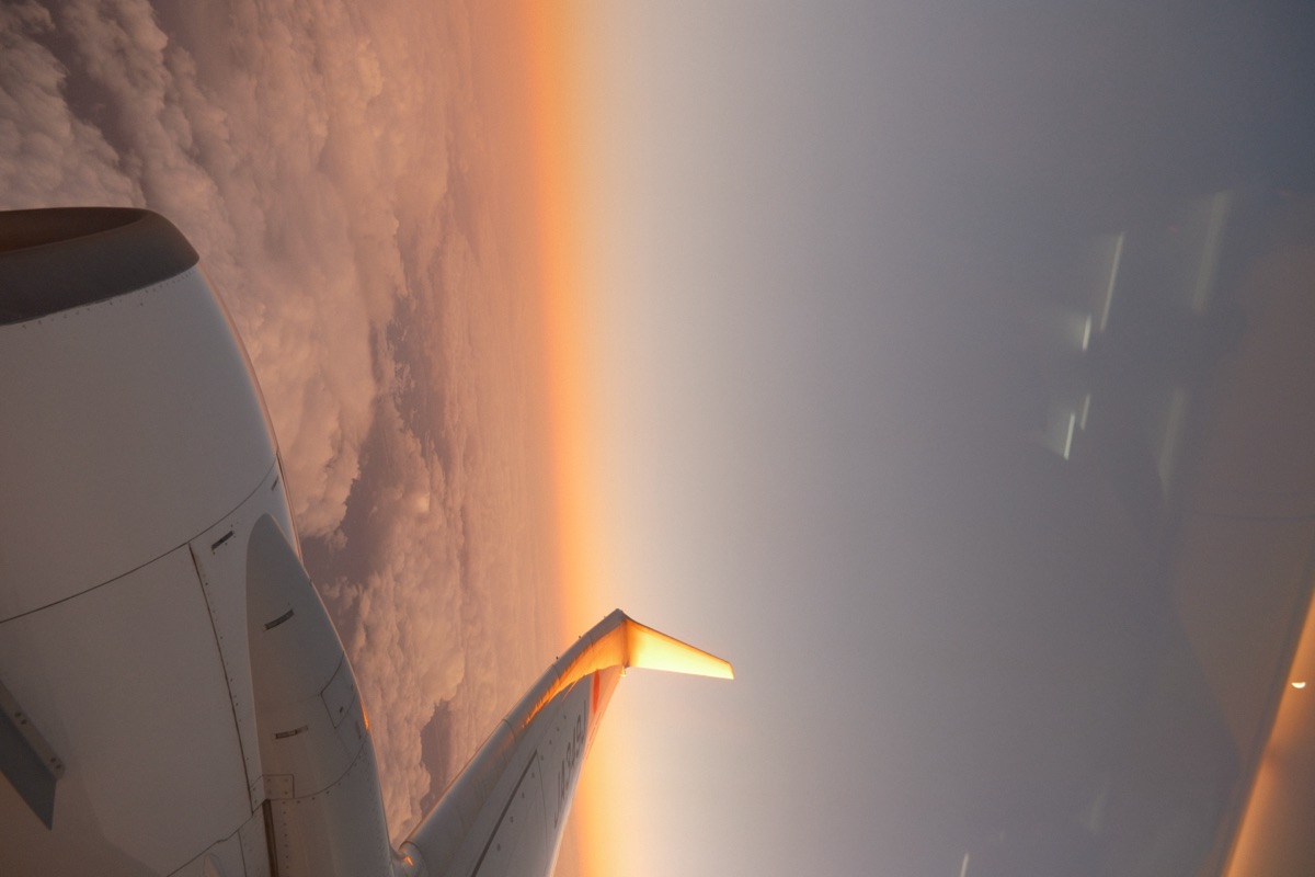 View from airplane window at sunset
